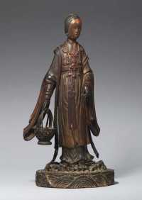 17TH CENTURY A GILT AND LACQUERED WOOD FIGURE OF HE XIAN GU